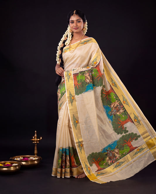 Cream Kerala kasavu saree with nature mural print featuring elephants, trees and river with gold zari border