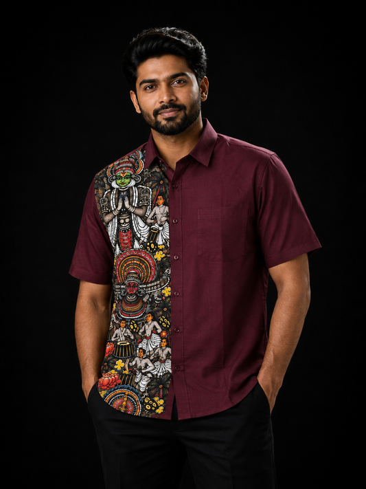 Man wearing a maroon short-sleeve shirt with a Kerala art panel on the left featuring Kathakali, Theyyam, classical dancers and floral motifs